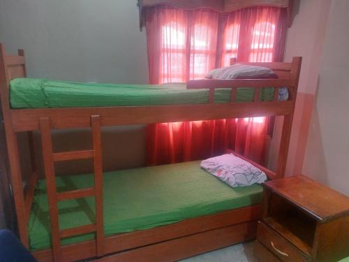 a couple of bunk beds in a room at Hostal Pablito in Encarnación