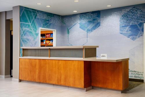 a reception desk with a large map on the wall at SpringHill Suites Richmond Northwest in Richmond