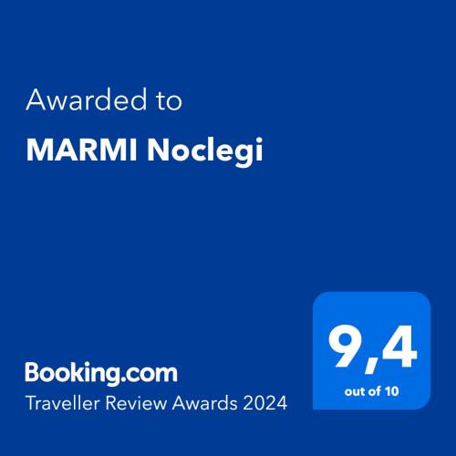 a blue screen with the text awarded to mannum nordicism at MARMI Noclegi in Golczowice