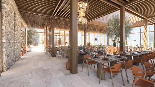 a restaurant with tables and chairs in a room at Elios Hill in Hersonissos