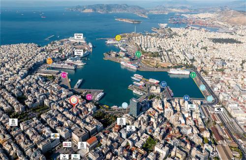 an aerial view of a city with a harbor at Piraeus City Hotel in Piraeus