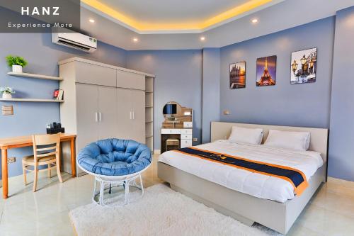 a bedroom with a bed and a desk and a chair at S79 Light House Condo Hotel Hanoi in Hanoi