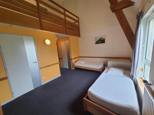 Postel nebo postele na pokoji v ubytování Gîte de Manehouarn