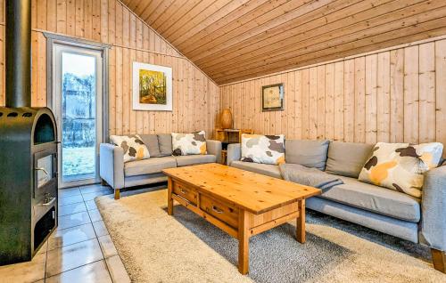 a living room with a couch and a coffee table at 3 Bedroom Gorgeous Apartment In Rechlin in Rechlin