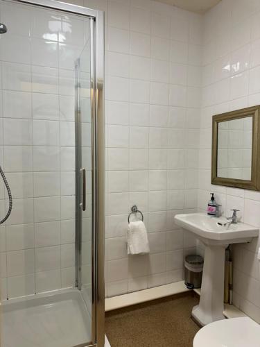 a bathroom with a shower and a sink at The Old Poets Corner in Chesterfield