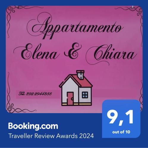 un panneau avec une maison sur fond rose dans l'établissement Appartamento Elena & Chiara, à Rome