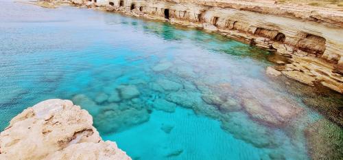 an aerial view of a body of water at MAYA in Paphos City