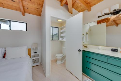 a bathroom with a bed and a toilet in a room at Serene Irish Beach Home with Panoramic Ocean Views! in Manchester