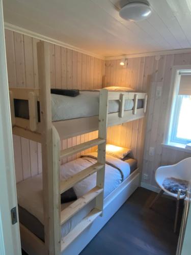 a couple of bunk beds in a room at Adventure Guesthouse Sweden in rural area Sunne in Sunne
