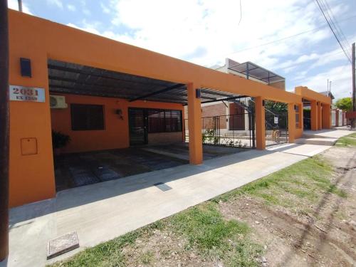 an empty building with an orange roof at Sierras Alojamiento SUITE in Mina Clavero