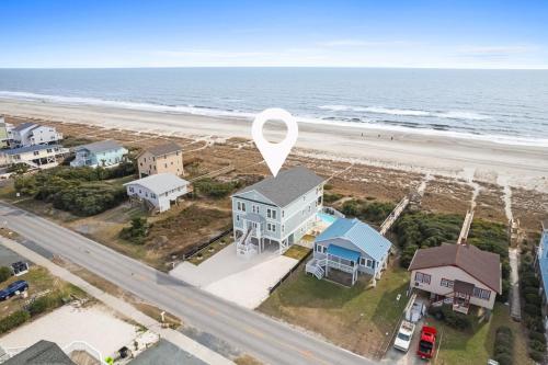 an aerial view of a house next to the beach at Fish-N-Chips by the Sea home in Holden Beach