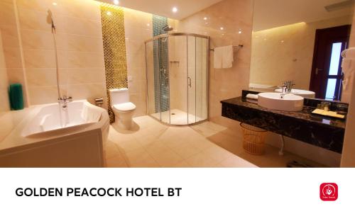 a bathroom with a toilet sink and a shower at Golden Peacock Hotel Blantyre in Blantyre