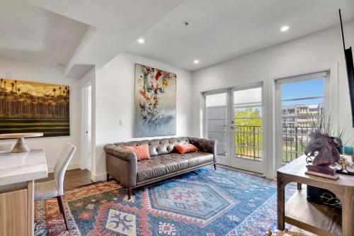 a living room with a couch and a table at 13 Luxury apartment in Los Angeles