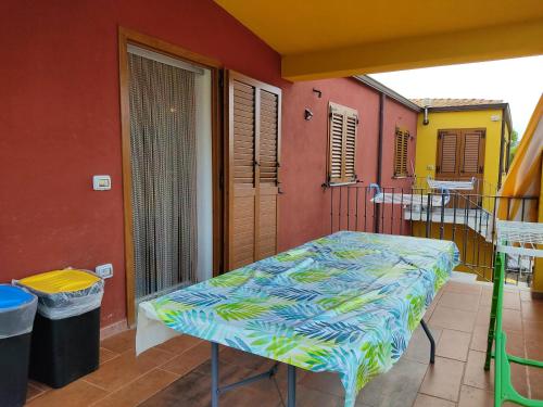 a room with a bed on a balcony at Modern Apartment with Pool near Cardedu - 85 sqm in Cardedu
