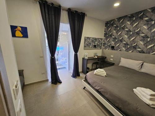 Ένα ή περισσότερα κρεβάτια σε δωμάτιο στο B&B Napoli Mitologica