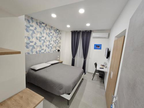 Ένα ή περισσότερα κρεβάτια σε δωμάτιο στο B&B Napoli Mitologica