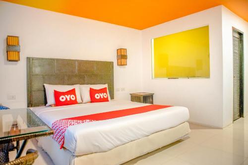 Cama o camas de una habitación en OYO 126 Patong Station House