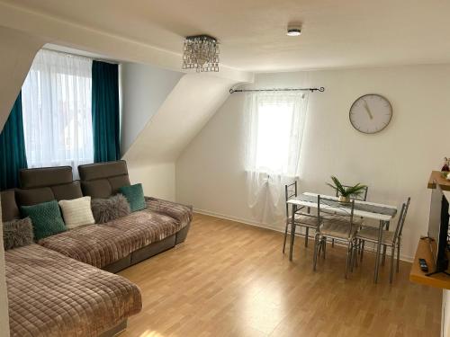 a living room with a couch and a table at Wohnung VS 3 in Villingen-Schwenningen