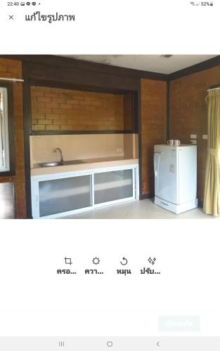 a kitchen with a sink and a refrigerator at Wilai Villa Lamai in Lamai