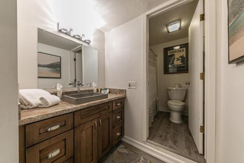a bathroom with a sink and a toilet at Charming Studio Deluxe w/Full Kitchen #115 at Donner Lake Village in Truckee