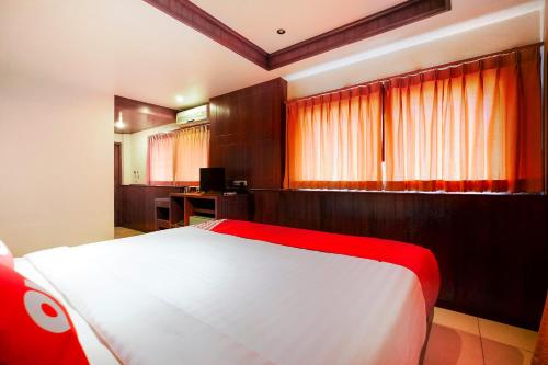 Cama o camas de una habitación en OYO 629 Chaytalay Palace Hotel