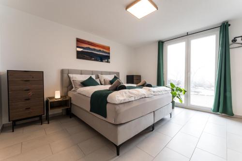 Ένα ή περισσότερα κρεβάτια σε δωμάτιο στο MATT - Apartments ' Design ' ruhig & lichtdurchflutet ' Natur