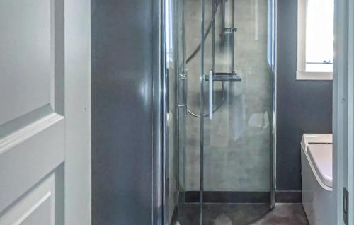 a shower with a glass door in a bathroom at 2 Bedroom Pet Friendly Home In Idkerberget in Idkerberget