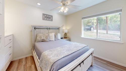 a bedroom with a bed and a window at Air Haus in Fourth Crossing