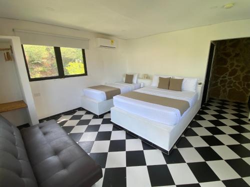 Uma cama ou camas num quarto em Akela Gaira Hotel
