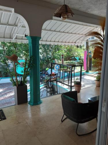 an open patio with a table and chairs and a table and chairsktop at Explora Prestige in Blue Bay