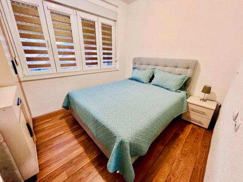 Ένα ή περισσότερα κρεβάτια σε δωμάτιο στο MIB Apartment