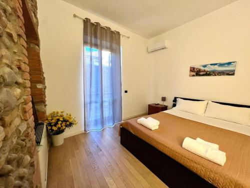 Ένα ή περισσότερα κρεβάτια σε δωμάτιο στο Bergamoincenter