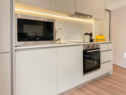 Dapur atau dapur kecil di Flora Guest House