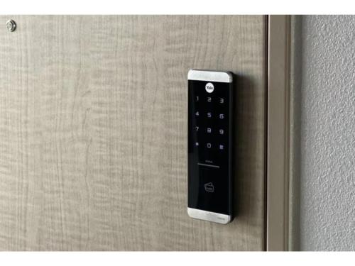 a remote control hanging on a wall at Eslead Hotel Namba South III - Vacation STAY 39775v in Osaka