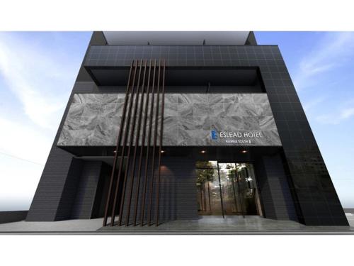 a building with a sign on the front of it at Eslead Hotel Namba South III - Vacation STAY 39775v in Osaka