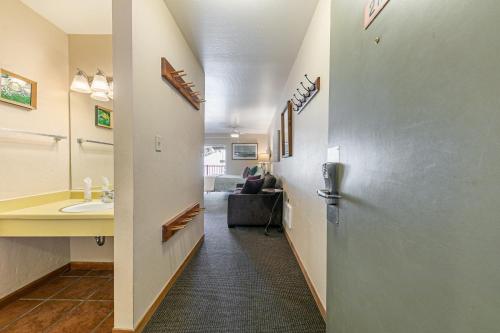 a hallway with a sink and a bathroom at Studio 2nd Floor Unit 217 Bldg B in Truckee