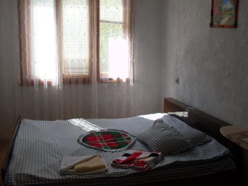 Ένα ή περισσότερα κρεβάτια σε δωμάτιο στο Guest House Jani