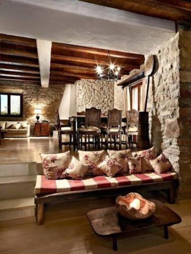 a living room with a couch and a table at Villa Icarus, Private Luxury Villa in Kampos Paros