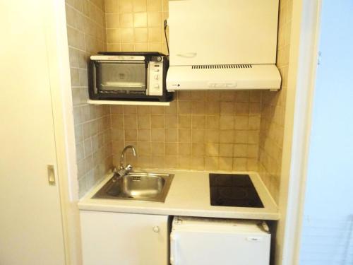 Kuchyňa alebo kuchynka v ubytovaní Residence Aixilia - Au coeur de la ville, studio pour 2 personnes ! MAE-7494