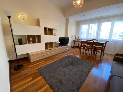 a living room with a table and a dining room at Diamond Apartment in Rome