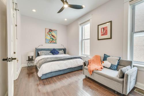 a bedroom with a bed and a couch at Spacious Chicago Home with Deck about 3 Mi to Downtown! in Chicago