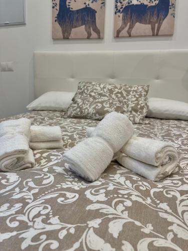 Posteľ alebo postele v izbe v ubytovaní Alfonso XIII Aparments 1