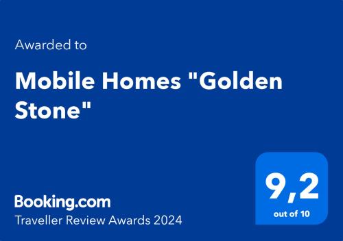 Um certificado, prêmio, placa ou outro documento exibido em Mobile Homes "Golden Stone"