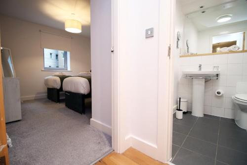 a room with a bathroom with a sink and a toilet at Bright 1Bedroom Apartment, Central Location with Balcony in Bristol