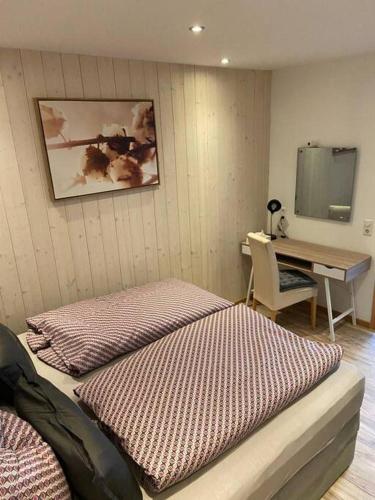 Postel nebo postele na pokoji v ubytování Gemütliche Ferienwohnung an der Eyach