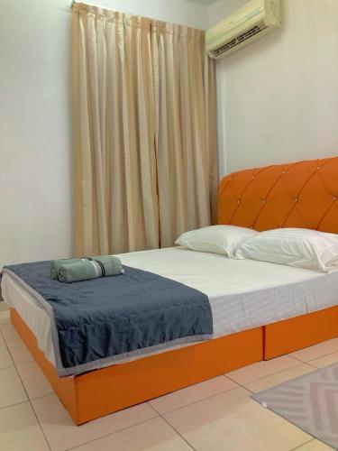 Ένα ή περισσότερα κρεβάτια σε δωμάτιο στο NR Cyber2 Homestay