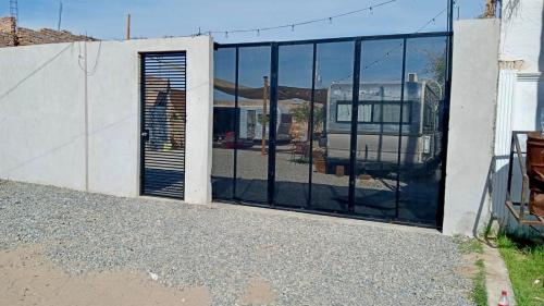 a sliding glass door with a view of a building at Increíble Moderno Espacio Unico in San Luis Río Colorado