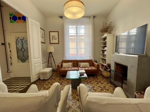 a living room with a couch and a fireplace at Casa en Palafrugell - Costa Brava in Palafrugell