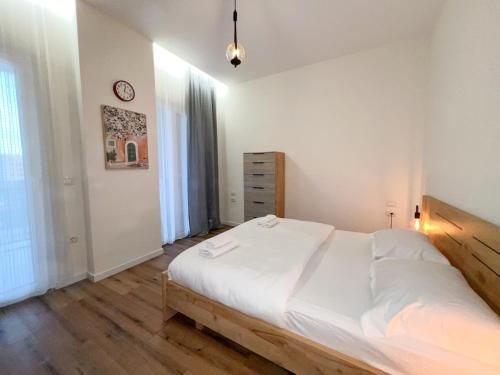 Llit o llits en una habitació de Cane Apartment Emerald