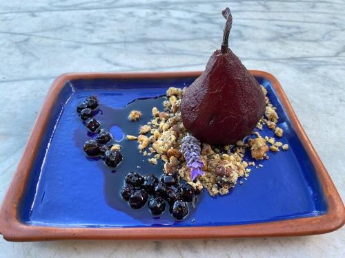 a blue plate with a chocolate dessert on it at Patios de Cafayate - Wine Hotel & Restaurant in Cafayate